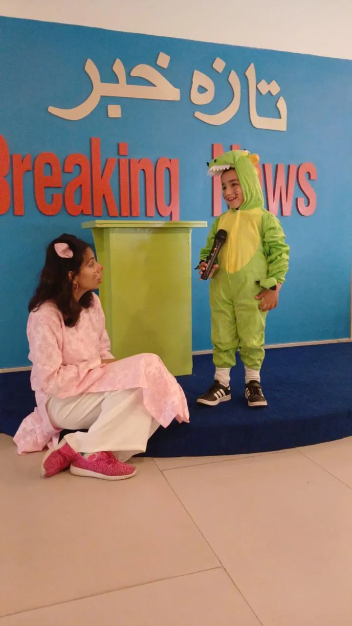 A young child presenting during an early years activity